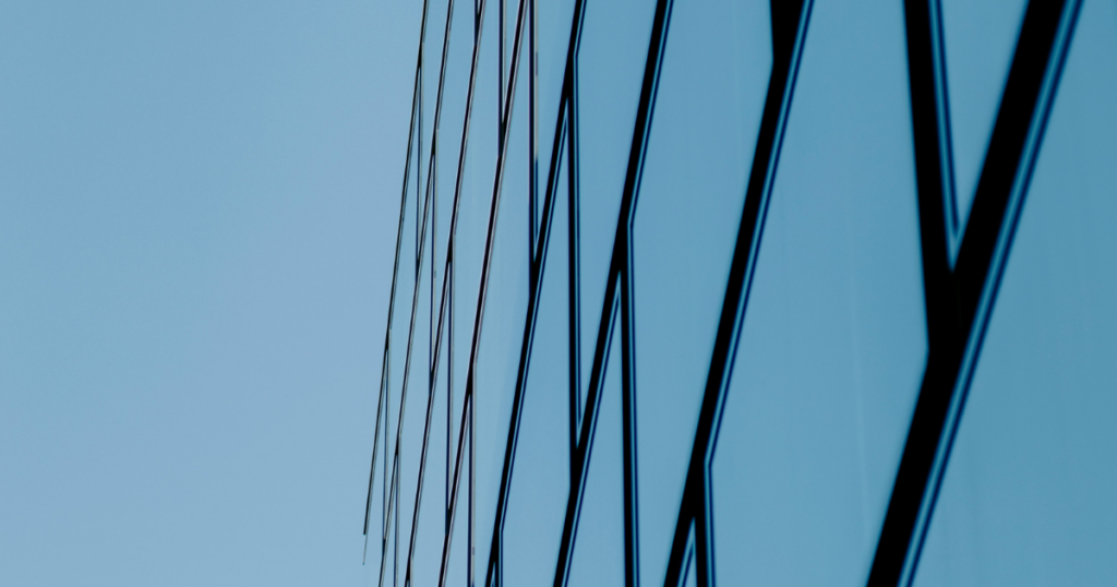 modern architectural symmetry, converging lines building, minimalist concrete architecture, structural perspective