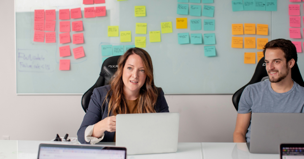 woman and man working together in an office
